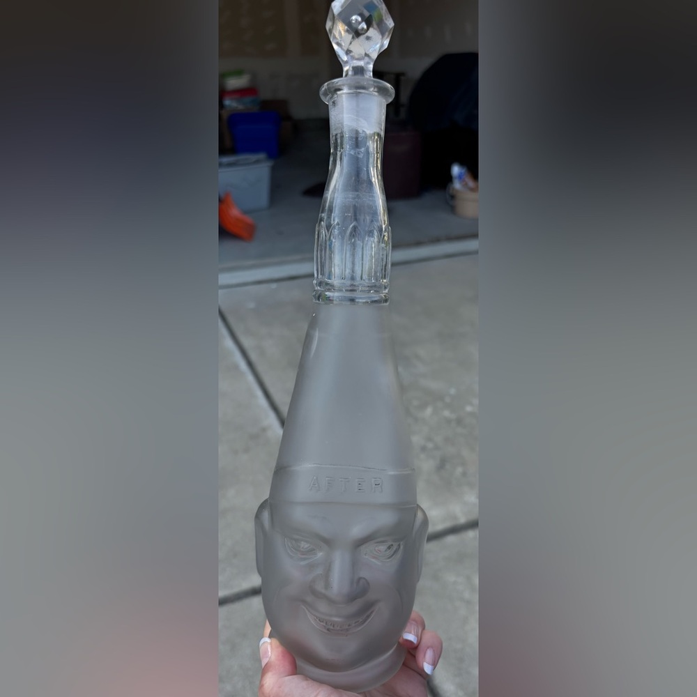 North Wheeling vintage two face glass bottle